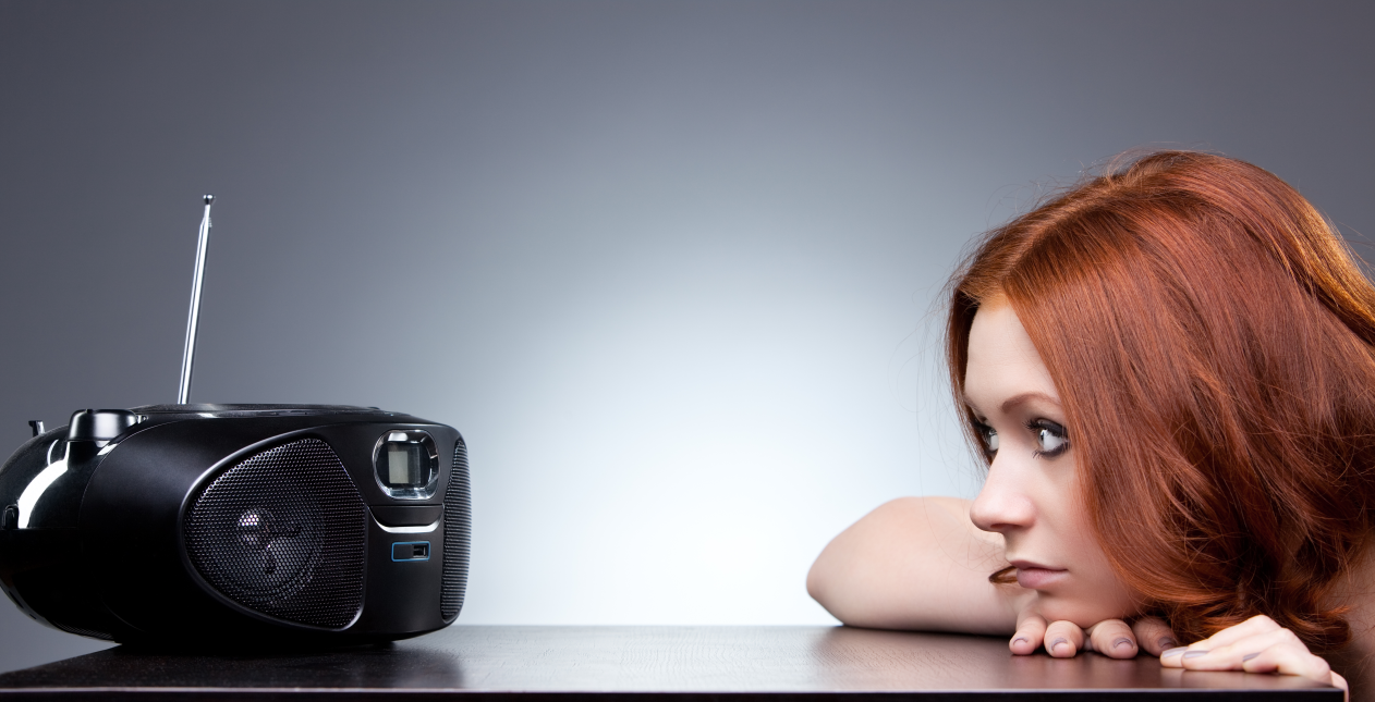 Woman is listening to radio.